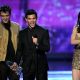Robert Pattinson, Taylor Lautner, and Kristen Stewart accept the Favorite Movie award onstage during the 2011 People’s Choice Awards at Nokia Theatre L.A. Live in Los Angeles on January 5, 2011