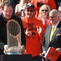 San Francisco Giants manager Bruce Bochy carries the World Series trophy at the conclusion of the Giants’ victory parade, San Francisco, November 3, 2010