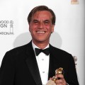 Writer Aaron Sorkin poses with his award for Best Screenplay (Motion Picture) for “The Social Network” in the press room at the 68th Annual Golden Globe Awards held at The Beverly Hilton hotel in Beverly Hills on January 16, 2011