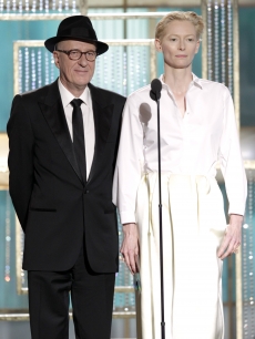Geoffrey Rush and Tilda Swinton speak onstage during the Golden Globes at the Beverly Hilton International Ballroom in Beverly Hills on January 16, 2011 