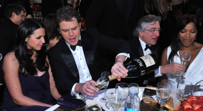 Matt Damon and wife Luciana, along with Robert De Niro, enjoy the scene inside the 2011 Golden Globes