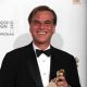 Writer Aaron Sorkin poses with his award for Best Screenplay (Motion Picture) for “The Social Network” in the press room at the 68th Annual Golden Globe Awards held at The Beverly Hilton hotel in Beverly Hills on January 16, 2011