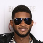 Usher poses for pictures at the (BELVEDERE) RED launch in Hollywood, California on February 10, 2011