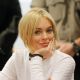Lindsay Lohan sneaks a glimpse of the cameras at her arraignment for a felony count of grand theft in Los Angeles on February 9, 2011. Lohan was charged with allegedly stealing a $2,500 necklace from a jewelry store in Venice, Calif.