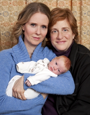 Cynthia Nixon and Christine Marinoni pose with their son Max on February 11, 2011 in New York City
