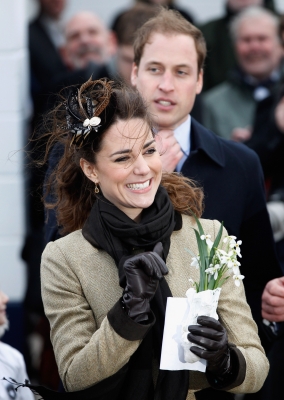 Prince William and Kate Middleton wave to the crowds after officially launching the new RNLI’s lifeboat, Hereford Endeavour, at Trearddur Bay, Anglesey on February 24, 2011