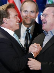 Tom Arnold congratulates Schwarzenegger on his win for second term