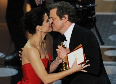 Colin Firth accepts the award for Best Performance by an Actor in a Leading Role for “The King’s Speech” from presenter Sandra Bullock onstage during the 83rd Annual Academy Awards held at the Kodak Theatre, Hollywood, Calif., on February 27, 2011