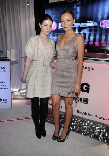 Michelle Trachtenberg and Malin Akerman smile while checking out the LG Cinema 3D HDTV
