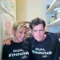 Charlie Sheen and his “goddess” Natalie Kenly wearing Charlie’s new T-shirts, “Duh, Winning”
