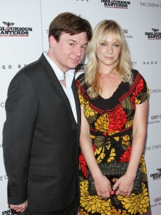 Mike Myers and Kelly Tisdale attend The Cinema Society & Hugo Boss screening of “Inglourious Basterds” at SVA Theater in New York City on August 17, 2009