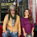 Johnny Depp and Penelope Cruz pose for photographers during the installation ceremony for her star on the Hollywood Walk of Fame in Hollywood, Calif. on April 1, 2011