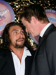 Billy Bush stares down “Conan the Barbarian” hunk Jason Momoa at CinemaCon 2011 in Las Vegas, Nevada on March 31, 2011   
