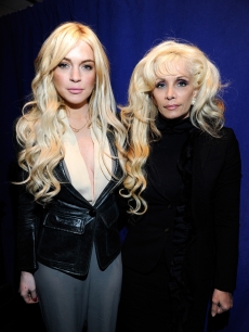 Lindsay Lohan and Victoria Gotti pose together the “Gotti” press conference at Sheraton New York Hotel & Towers, Central Park West Room in New York City on April 12, 2011
