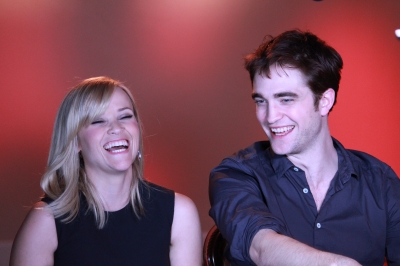 Reese Witherspoon laughs as she and Robert Pattinson share tales of making “Water for Elephants,” Santa Monica, April 3, 2011