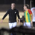 Prince William smiles while playing soccer in a South London park on April 26, 2011