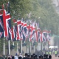 Police walk along the Mall ahead of the Royal Wedding of Prince William to Catherine Middleton at Westminster Abbey, London, on April 29, 2011