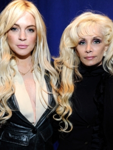 Lindsay Lohan and Victoria Gotti pose together the “Gotti” press conference at Sheraton New York Hotel & Towers, Central Park West Room in New York City on April 12, 2011