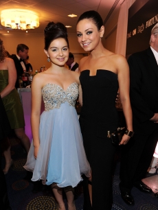 “Modern Family” actress Ariel Winter and Mila Kunis pose for a picture at the 2011 White House Correspondents’ Association Dinner at the Washington Hilton in Washington, DC, on April 30, 2011 