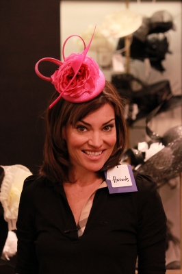 Pretty in pink! Access Hollywood Live’s Kit Hoover tries on another beautiful hat at Harrods in London, April 26, 2011