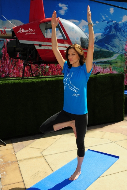 Tricia Helfer participates in virtual heli-yoga at Irvine Spectrum Center as part of Travel Alberta’s kick-off to the summer travel season, Tuesday, April 12, 2011
