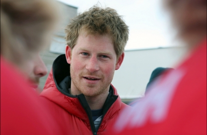 Britain’s Prince Harry smiles before departing for the airport to load their kit before the flight to the Borneo ice field on April 2, 2011
