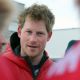 Britain’s Prince Harry smiles before departing for the airport to load their kit before the flight to the Borneo ice field on April 2, 2011