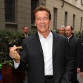 Arnold Schwarzenegger smokes a cigar in Milan, Italy on November 18, 2009