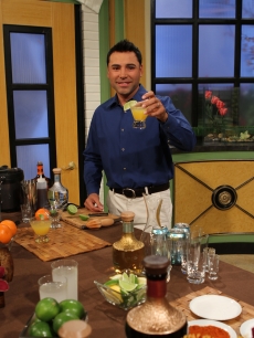 Oscar de la Hoya shows Billy Bush and Kit Hoover his favorite margarita recipe on Access Hollywood Live to celebrate Cinco de Mayo on May 5, 2011