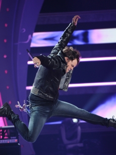 James Durbin jumps during his performance of “Love Potion No. 9” on “American Idol,” May 11, 2011