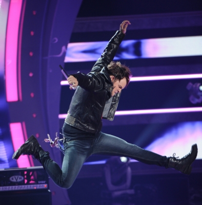 James Durbin jumps during his performance of “Love Potion No. 9” on “American Idol,” May 11, 2011