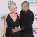Carey Hart pats wife Pink’s pregnant tummy at the 2010 American Music Awards held at Nokia Theatre L.A. Live in Los Angeles on November 21, 2010