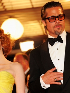 Jessica Chastain and Brad Pitt pose on the red carpet leave the screening of “The Tree of Life” presented in competition at the 64th Cannes Film Festival on May 16, 2011
