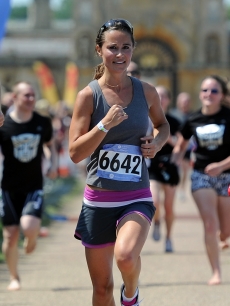 Pippa Middleton approaches the finish line during the GE Blenheim Triathlon at Blenheim Palace in Woodstock, England, on June 4, 2011 