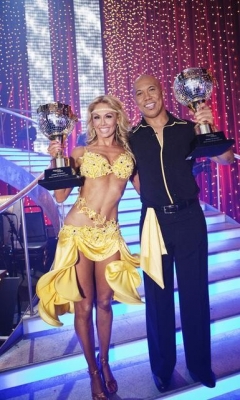 Kym Johnson and Hines Ward hold up their mirrorball trophies for winning Season 12 of “Dancing with the Stars,” May 24, 2011