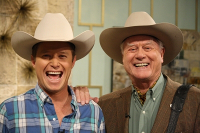 Billy Bush and Larry Hagman show off their matching cowboy hats on Access Hollywood Live on May 25, 2011