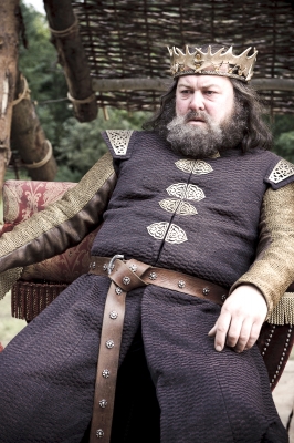 King Robert Baratheon (Mark Addy) watches the tournament for the Hand of the King, “Game of Thrones,” HBO, 2011