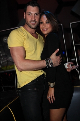 “Dancing With The Stars” pros Cheryl Burke and Maksim Chmerkovskiy share a hug at Moon Nightclub inside the Palms Casino Resort, Las Vegas, May 28, 2011