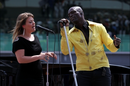 Kelly Clarkson and Seal perform the USA National Anthem prior to the IZOD IndyCar Series Indianapolis 500 Mile Race at Indianapolis Motor Speedway in Indianapolis, Indiana, on May 29, 2011 
