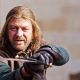 Eddard Stark (Sean Bean) holds up his sword in “Game of Thrones,” HBO, 2011