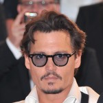 Johnny Depp departs the “Pirates of the Caribbean: On Stranger Tides” premiere during the 64th Annual Cannes Film Festival at Palais des Festivals on May 14, 2011 in Cannes, France