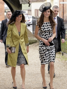 Pippa Middleton and Catherine, Duchess of Cambridge attend the wedding of Sam Waley-Cohen and Annabel Ballin at St. Michael and All Angels church in Lambourn, England, on June 11, 2011