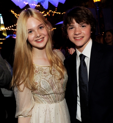 Elle Fanning and Joel Courtney step out at the “Super 8” premiere in Westwood, Calif. on June 8, 2011 