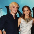 Tom Felton and Emma Watson smile during a photocall for ‘Harry Potter And The Half-Blood Prince’ at Claridge’s Hotel in London on July 6, 2009