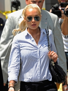 Lindsay Lohan leaves the Airport Branch Courthouse after a probation hearing in Los Angeles on June 23, 2011 