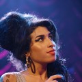 Amy Winehouse performing on stage in 2007