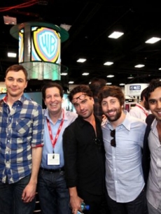 “The Big Bang Theory” cast poses with Warner Bros. Television President Peter Roth at the Warner Bros. Comic-Con booth in San Diego, Calif., on July 22, 2011