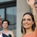 Brad Pitt and Angelina Jolie wave to fans on the red carpet before attending the closing ceremony of the 17th Sarajevo Film Festival  at the national theater in downtown Sarajevo on July 30, 2011