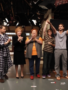 Ashton Kutcher waves during the curtain call after filming the  season premiere episode of “Two and a Half Men,” alongside  Marin Hinkle, Jon Cryer, Holland Taylor, Conchata Ferrell and Angus T. Jones