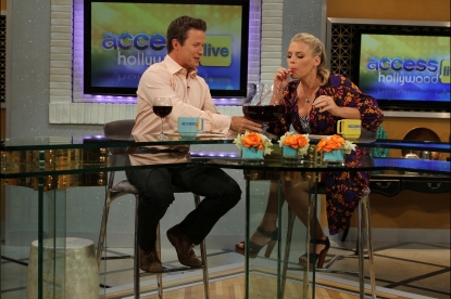 “Cougar Town’s’” Busy Philipps enjoys a little taste of Big Carl II’s contents as she co-hosts Access Hollywood Live with Billy Bush, July 28, 2011